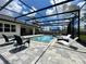 Gorgeous outdoor screened pool with a spa, and seating area for ultimate relaxation and entertainment at 20414 Quinn St, Orlando, FL 32833