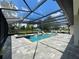 Inviting screened pool with hot tub and luxurious lounge furniture for relaxation and enjoyment at 20414 Quinn St, Orlando, FL 32833