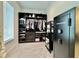 Custom walk-in closet with generous shelving and storage solutions, and a secure safe for valuables at 20414 Quinn St, Orlando, FL 32833