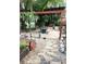 Landscaped backyard with stone patio, pergola, and inviting fire pit area, ideal for relaxation at 2082 Starboard Dr, Geneva, FL 32732
