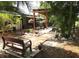 Backyard has tropical landscaping with a pergola, outdoor seating, walkway, and garden space at 2082 Starboard Dr, Geneva, FL 32732