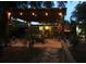 Backyard with patio, pergola, stone walkway, lush landscaping, and outdoor seating at 2082 Starboard Dr, Geneva, FL 32732