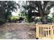 Extensive yard with lots of plants, wooden bridge, and boat house overlooking the water at 2082 Starboard Dr, Geneva, FL 32732