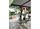 Scenic backyard with patio, seating, and lush tropical foliage at 2082 Starboard Dr, Geneva, FL 32732