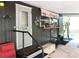 Exterior entrance showcases a step-up porch with seating, storage, and charming decor at 2082 Starboard Dr, Geneva, FL 32732