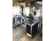 The outdoor kitchen area has stainless steel appliances, running water, and an overhead fan at 2082 Starboard Dr, Geneva, FL 32732