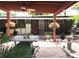 Charming outdoor patio with decorative table and lush landscaping to enjoy the weather at 2082 Starboard Dr, Geneva, FL 32732