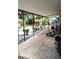 Paver patio with covered area, surrounded by lush greenery and offering outdoor living space at 2082 Starboard Dr, Geneva, FL 32732