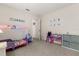 A bedroom with carpeted floors with princess themed decor and toys at 2263 Mallory Cir, Haines City, FL 33844
