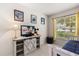 Decorated bedroom with charming furniture, Disney themed decor and window view at 2263 Mallory Cir, Haines City, FL 33844