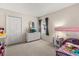 A bedroom with carpeted floors, a dresser with television, and a window at 2263 Mallory Cir, Haines City, FL 33844
