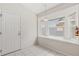 An eat-in nook with a window bench and white tile floors next to a white door at 2263 Mallory Cir, Haines City, FL 33844