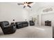Large living room with carpet, ceiling fan, vaulted ceilings, skylight, and contemporary furnishings at 2263 Mallory Cir, Haines City, FL 33844