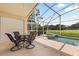 Covered patio area with pool, jacuzzi, and outdoor furniture at 2263 Mallory Cir, Haines City, FL 33844