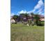 Lush backyard featuring a pool and screened enclosure, perfect for relaxing and enjoying the outdoors at 2357 Great Harbor Dr, Kissimmee, FL 34746