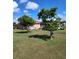 Spacious backyard with mature trees, offering shade and a serene setting at 2357 Great Harbor Dr, Kissimmee, FL 34746