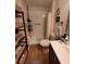 Bathroom featuring a walk-in shower with tile surround, modern fixtures, and a vanity at 2357 Great Harbor Dr, Kissimmee, FL 34746