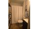 Bathroom featuring walk-in shower, modern vanity and fixtures, and wood-look tile at 2357 Great Harbor Dr, Kissimmee, FL 34746