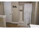 Neutral bathroom features a shower with curtain and wood-look flooring at 2357 Great Harbor Dr, Kissimmee, FL 34746