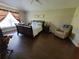 Bright bedroom with a large window, hard surface floors and comfortable furniture, providing a serene and relaxing space at 2357 Great Harbor Dr, Kissimmee, FL 34746