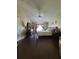 Spacious bedroom with wood floors, vaulted ceilings and ceiling fan, offering a comfortable and stylish retreat at 2357 Great Harbor Dr, Kissimmee, FL 34746