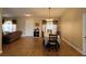 Dining area with tile flooring, modern lighting, and access to the front door and bedrooms at 2357 Great Harbor Dr, Kissimmee, FL 34746