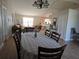 Inviting dining room connected to the living room featuring neutral decor and hardwood floors at 2357 Great Harbor Dr, Kissimmee, FL 34746