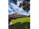 Side view of a single Gathering home with a manicured lawn and ample backyard space at 2357 Great Harbor Dr, Kissimmee, FL 34746