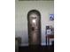 Hallway featuring wood-look tile floors and an arched doorway at 2357 Great Harbor Dr, Kissimmee, FL 34746