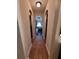 Hallway with decorative archways and tiled floors, connecting various rooms with a cohesive design at 2357 Great Harbor Dr, Kissimmee, FL 34746