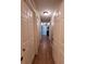 Hallway features wood tile flooring, fresh paint and provides access to the bedrooms at 2357 Great Harbor Dr, Kissimmee, FL 34746