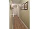 Hallway featuring tile floors, neutral paint and decorative wall hangings at 2357 Great Harbor Dr, Kissimmee, FL 34746