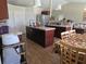 Modern kitchen with two islands, cherry wood cabinets, stainless appliances and tile backsplash at 2357 Great Harbor Dr, Kissimmee, FL 34746