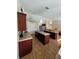 Open kitchen featuring double islands, tile floors, and stainless appliances at 2357 Great Harbor Dr, Kissimmee, FL 34746