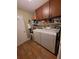 Functional laundry room with washer, dryer, and storage cabinets at 2357 Great Harbor Dr, Kissimmee, FL 34746