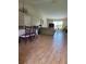 Open-concept living space with wood-look tile flooring and a dining area at 2357 Great Harbor Dr, Kissimmee, FL 34746