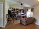 Cozy living room featuring wood-look tile flooring and a comfortable seating area at 2357 Great Harbor Dr, Kissimmee, FL 34746