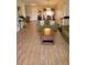 Comfortable living room featuring wood-look tile flooring and a welcoming atmosphere at 2357 Great Harbor Dr, Kissimmee, FL 34746