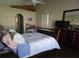 Spacious main bedroom featuring a walk-in closet, wood floors, and ample natural light at 2357 Great Harbor Dr, Kissimmee, FL 34746