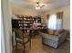 Inviting home office featuring ample shelving, wood floors, and a comfortable seating area at 2357 Great Harbor Dr, Kissimmee, FL 34746