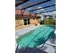 Sparkling screened-in pool, surrounded by a spacious deck, with a peaceful backyard view at 2357 Great Harbor Dr, Kissimmee, FL 34746