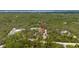 An aerial view of land surrounded by many trees and vegetation at 2576 R E Byrd Rd, Frostproof, FL 33843