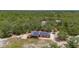 Beautiful view of the home and the surrounding wooded landscape at 2576 R E Byrd Rd, Frostproof, FL 33843