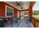 Entertain on the back porch, equipped with ceiling fans, a built-in grill, and lots of seating at 2576 R E Byrd Rd, Frostproof, FL 33843