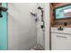 Stylish bathroom includes a tiled shower with updated fixtures and design at 2576 R E Byrd Rd, Frostproof, FL 33843