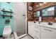 Modern bathroom boasting a double vanity, tiled shower, and stylish decor at 2576 R E Byrd Rd, Frostproof, FL 33843