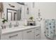 The bathroom features a stylish vanity, neutral countertops, and nautical themed decor at 2576 R E Byrd Rd, Frostproof, FL 33843