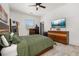 Bright bedroom featuring a ceiling fan, natural light and decorative wood dresser at 2576 R E Byrd Rd, Frostproof, FL 33843