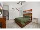 Bright bedroom showcasing the bed, natural light, and an abundance of closet space at 2576 R E Byrd Rd, Frostproof, FL 33843