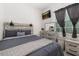 Cozy bedroom with natural light, dresser and modern ceiling fan at 2576 R E Byrd Rd, Frostproof, FL 33843